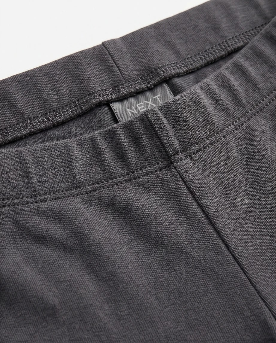 Grafitowe legginsy marki Next - widok 2